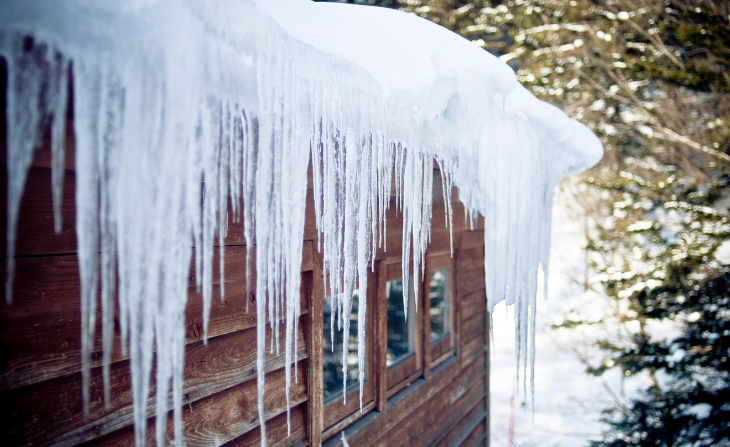 Frozen roof with icicles